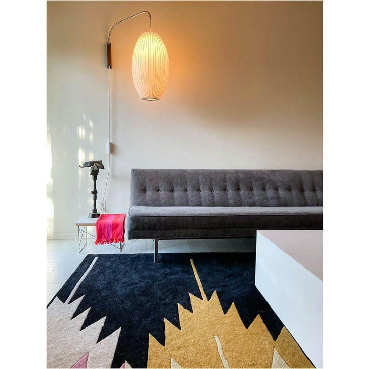 Moderne væglampe med kugledesign og varmt hvidt lys