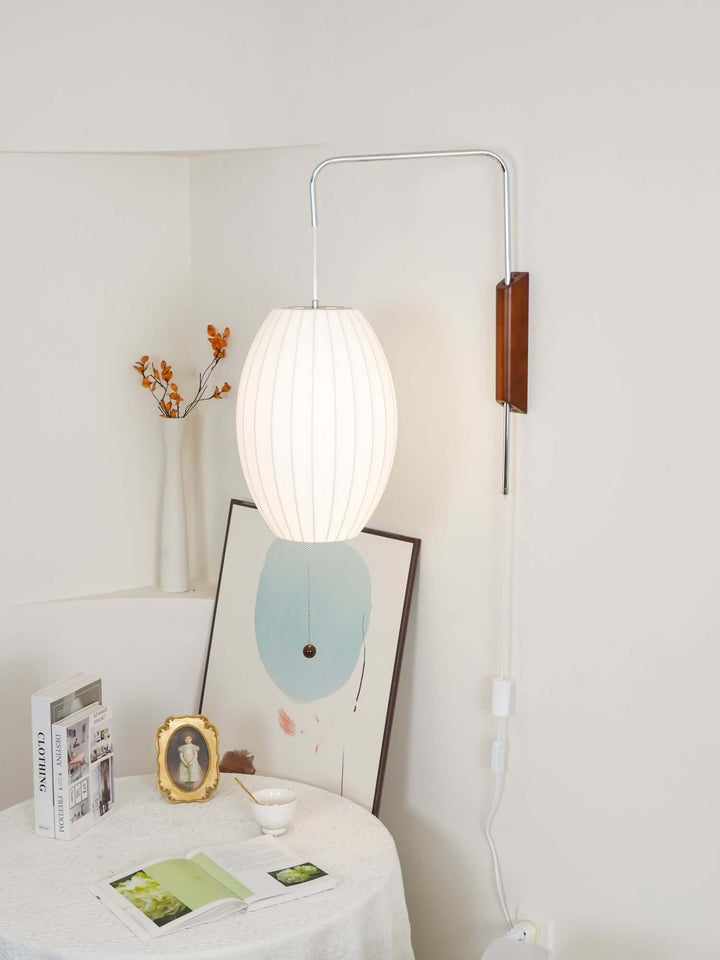 Moderne væglampe med kugledesign og varmt hvidt lys