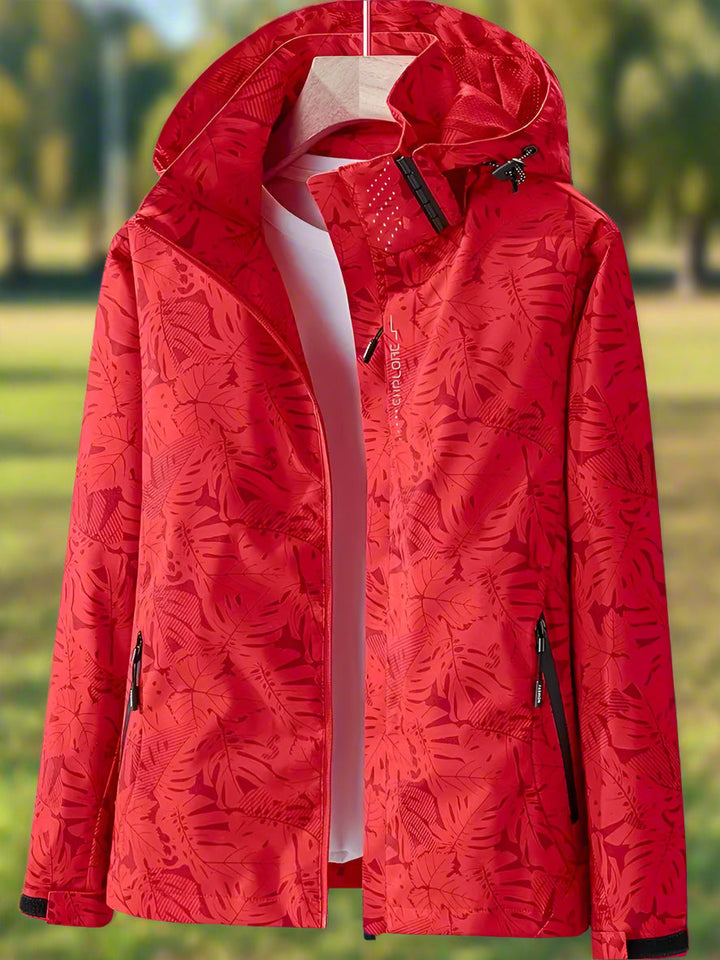 Letvægts vandtæt regnjakke til kvinder med elegant bladmønster. Ideel til outdoor og stilfuld mode.
