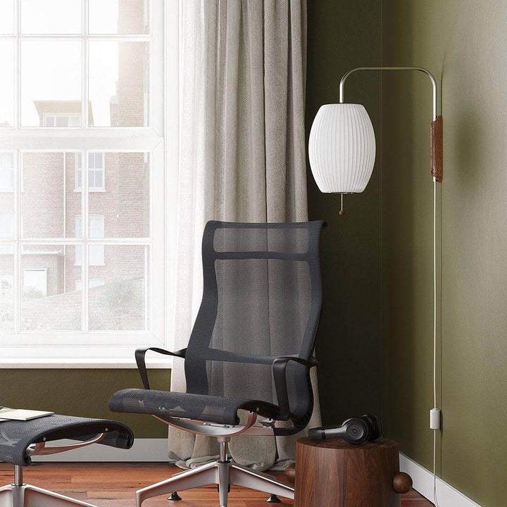 Moderne væglampe med kugledesign og varmt hvidt lys