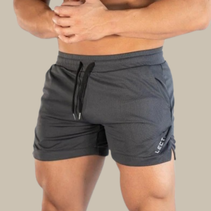 Stilfulde herreshorts til sommer med elastisk talje, snøre og lommer, perfekt til hverdagsbrug og sport.