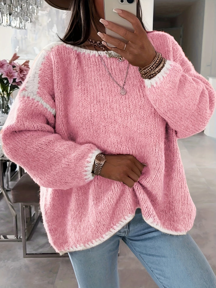 Dame sweater med løs pasform, bådudskæring og stilfulde kontrasterende detaljer. Komfortabel hverdagstøj.