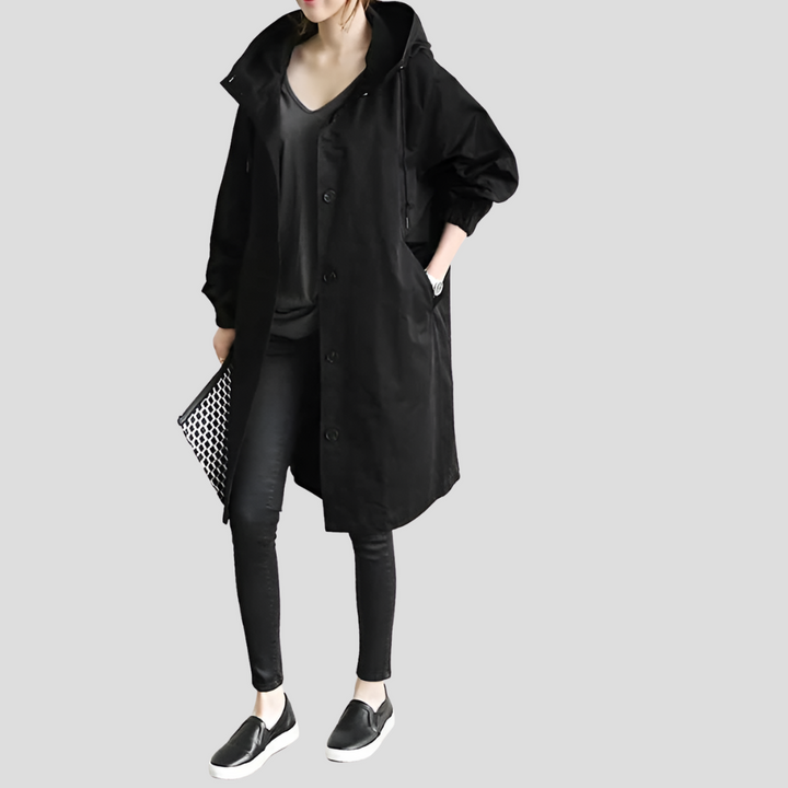 Elegant dame trenchcoat med oversized pasform, mellemlang og vandafvisende design.