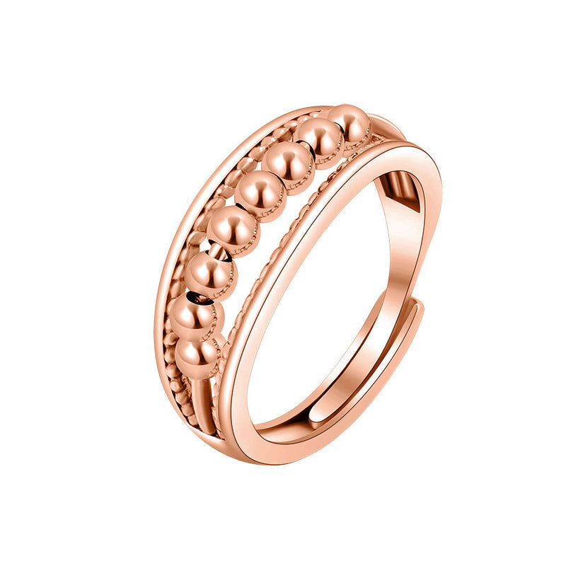 Snurrende ring med roterende perler, perfekt for stressaflastning. Unisex og justerbar fidget ring i rustfrit stål.