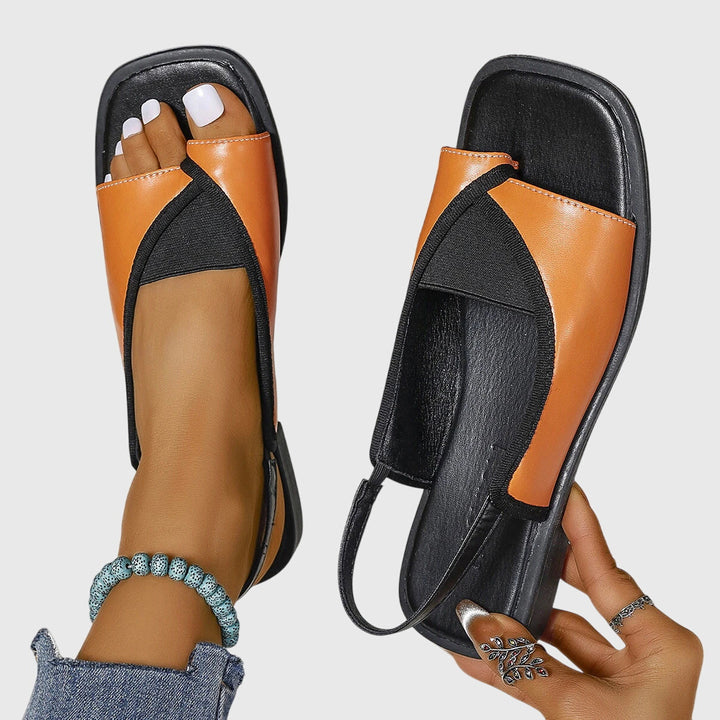 Stilfulde orange slip-on damesandaler. Komfortable, støttende og modebevidste ortopædiske sommersandaler.