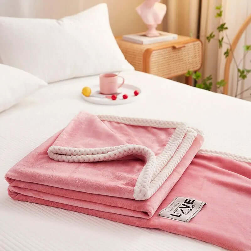 Hyggelig lyserød flannel fleece tæppe