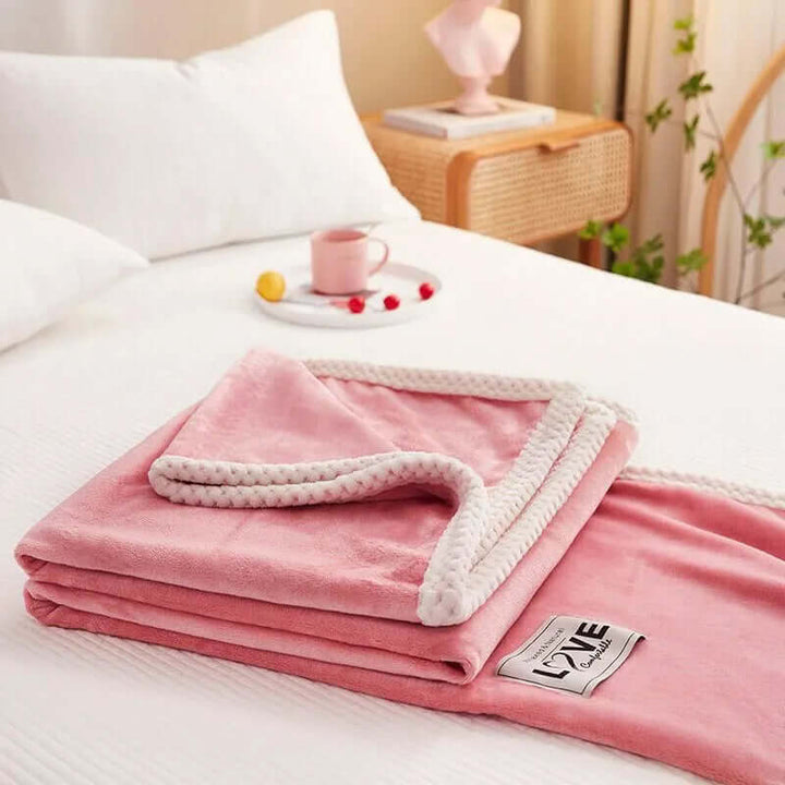 Hyggelig lyserød flannel fleece tæppe