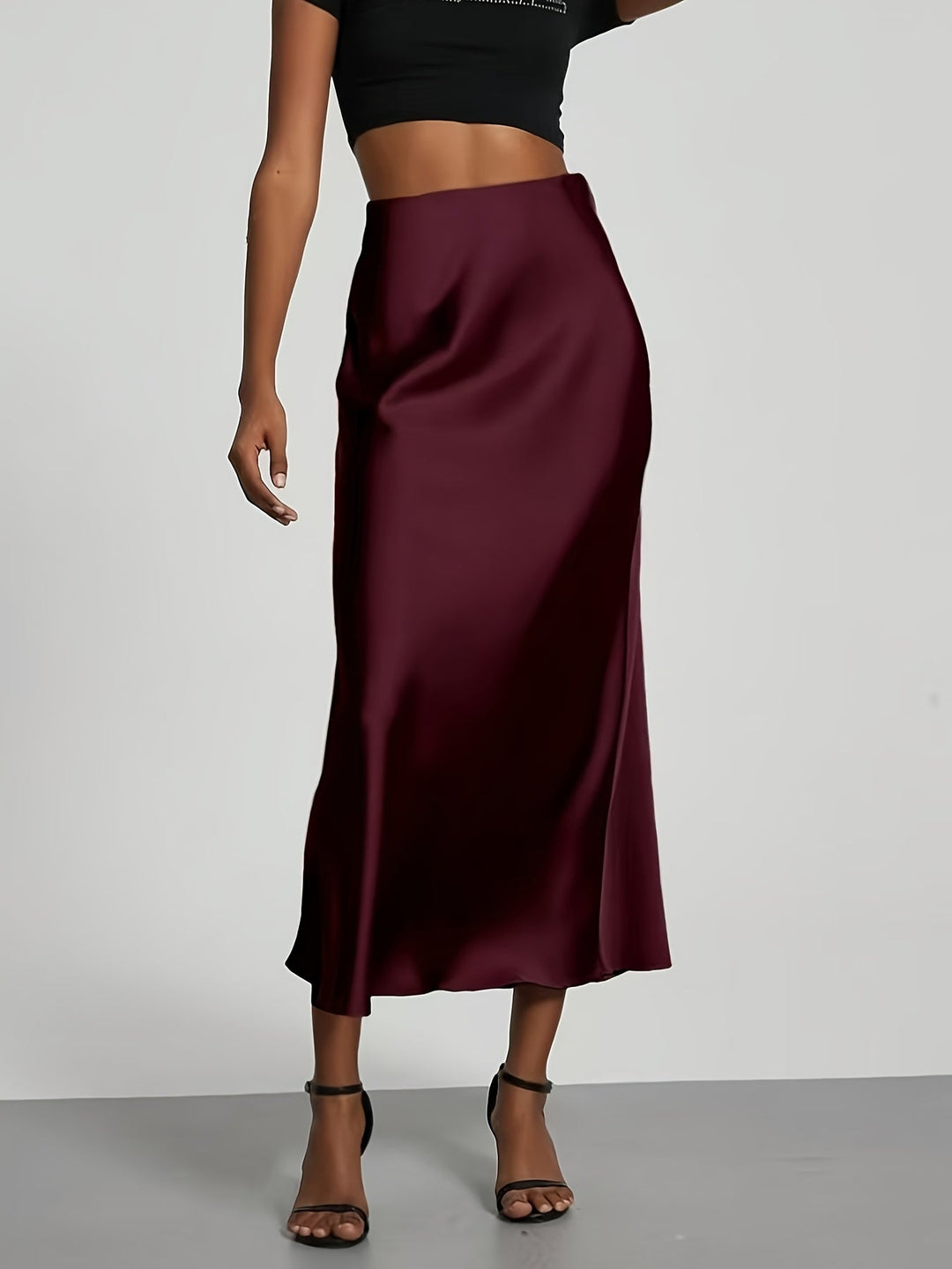 Formel maxi satinnederdel for kvinder, ideel til festlige lejligheder og et elegant look.