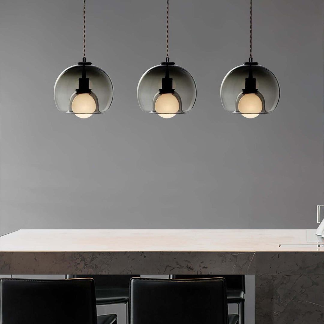 Moderne pendellampe i metal og glas