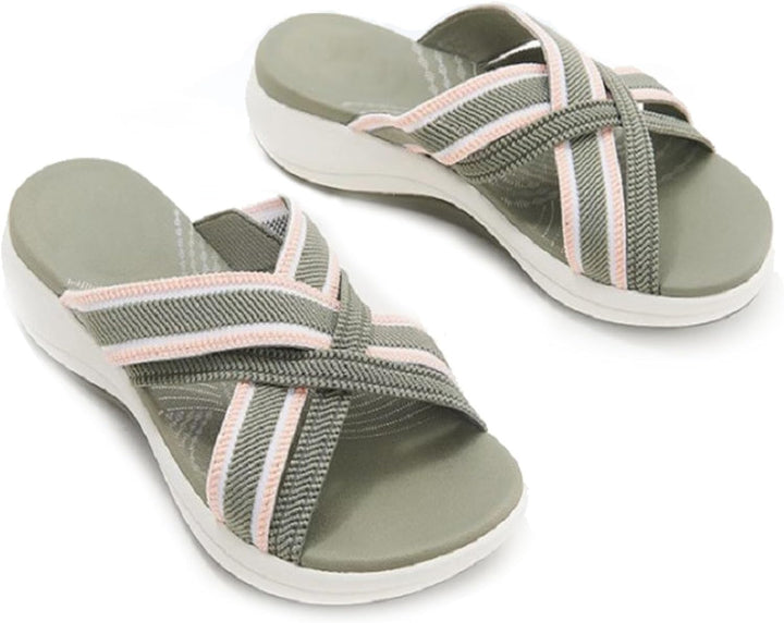 Oversigt over et par dame sandaler med krydsede stropper. Trendy sommer sandaler med et minimalistisk look.