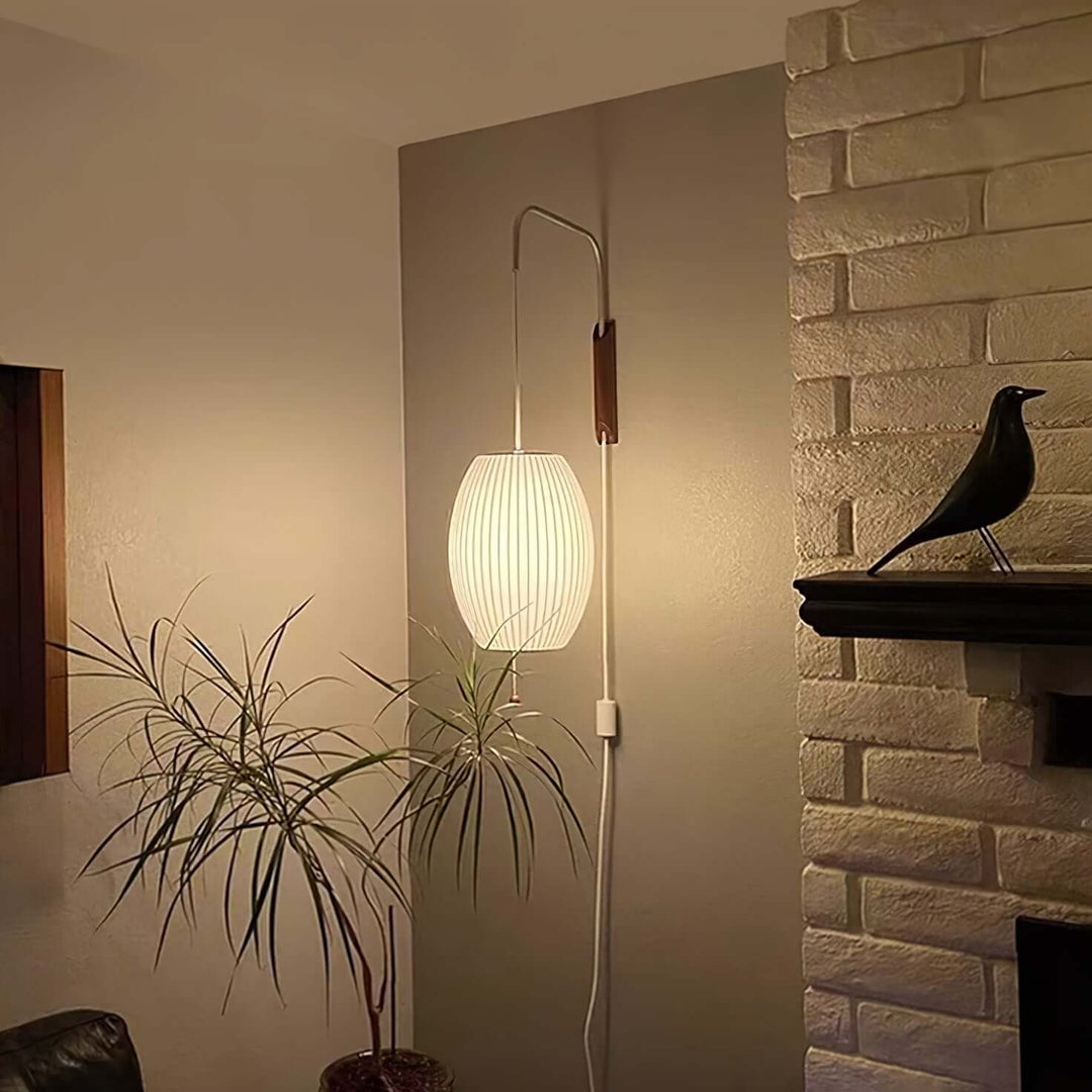 Moderne væglampe med kugledesign og varmt hvidt lys