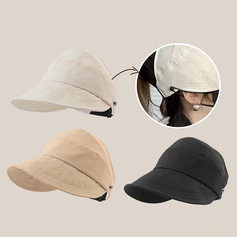 Elegant kvinders strandhat med åben top, bred skygge og effektiv UV-beskyttelse.