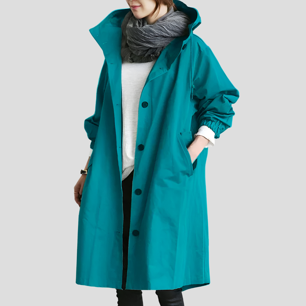 Stilren, vandafvisende mellemlang trenchcoat til kvinder, med rummelig oversized pasform.
