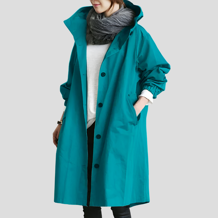 Stilren, vandafvisende mellemlang trenchcoat til kvinder, med rummelig oversized pasform.