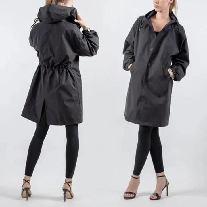 Alsidig dame trenchcoat, oversized og mellemlang, vandafvisende, ideel som yderbeklædning.