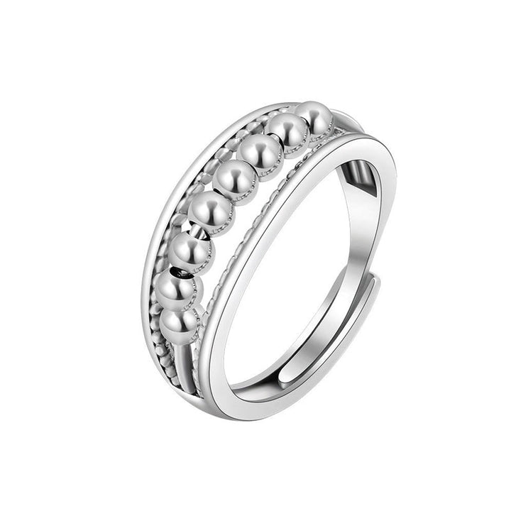 Snurrende fidget ring i rustfrit stål med justerbare, roterende perler. Unisex stressaflastende smykke.