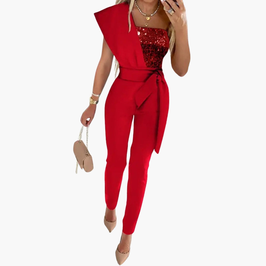 Stilfuld glitter jumpsuit med asymmetrisk en-skulder design og taljebælte for en festlig aften.