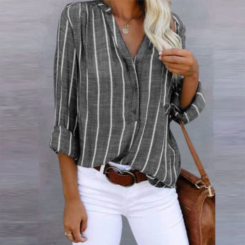 Smuk langærmet damebluse med stribet mønster og V-hals, der tilføjer elegance til dit outfit.