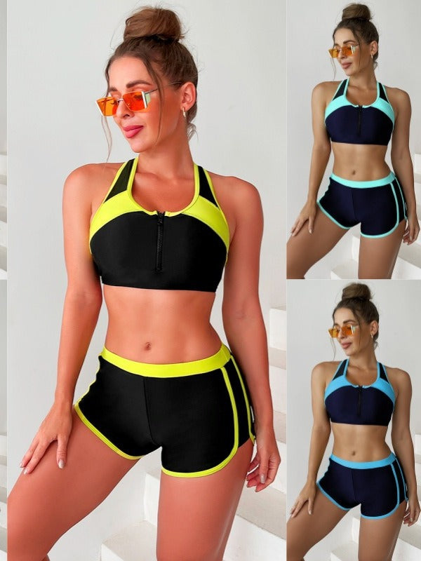 Sporty bikinisæt til damer med top og shorts, ideel til strand og vandsport.