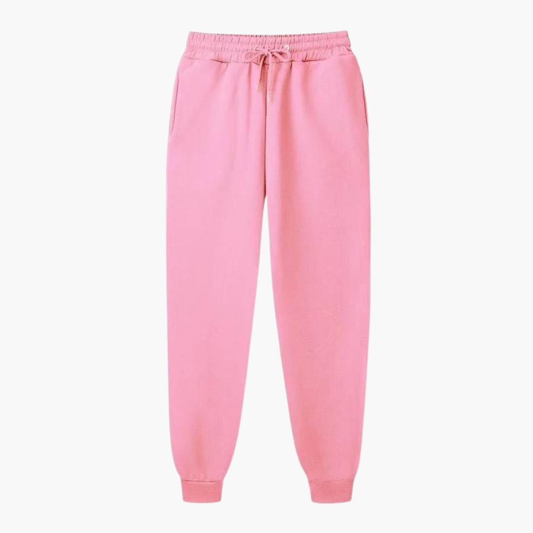 Klassiske sorte damebukser med elastisk talje og praktiske sidelommer, velegnet til mange outfits.