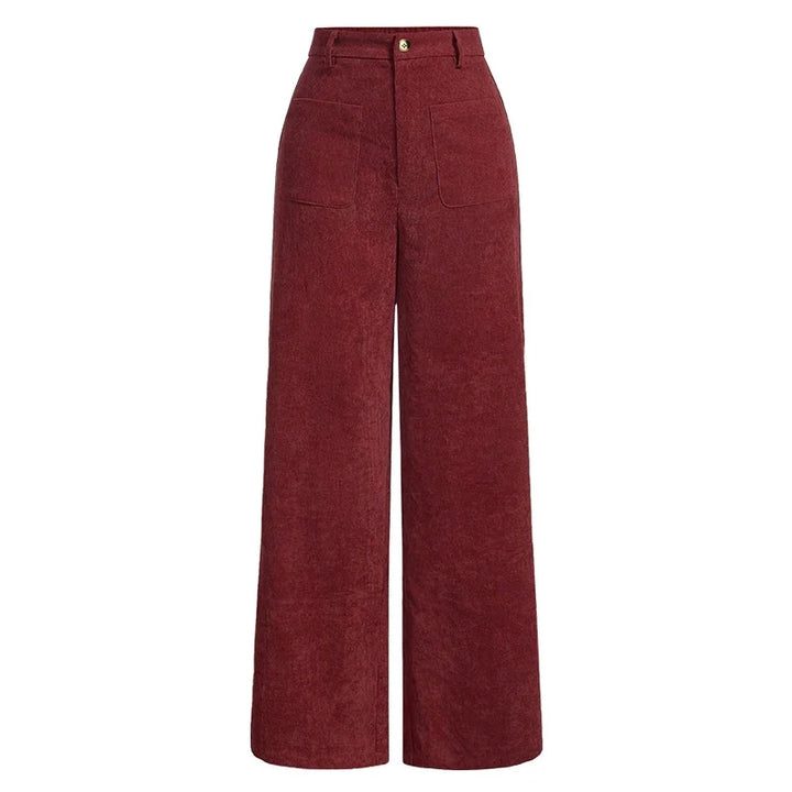 Detaljebillede af høj talje og stilfulde knapper på komfortable damejeans med praktiske lommer.