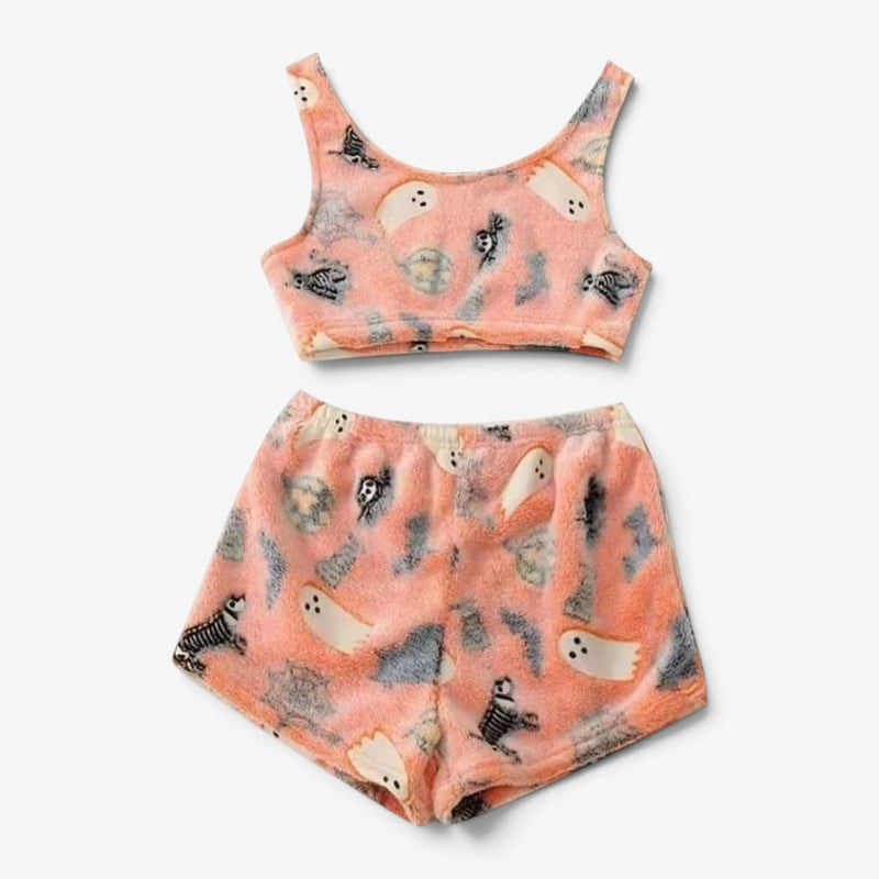 Afslappet dame Halloween nattøj: shorts og top med uhyggelige selvlysende spøgelser. Perfekt til efterårshyggen.
