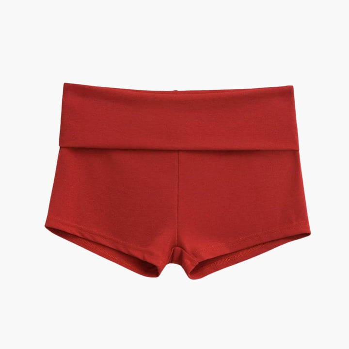 Kvinders sportsshorts med unikt slidsdesign og bred behagelig talje i abrikos, perfekte til aktiv fritid.