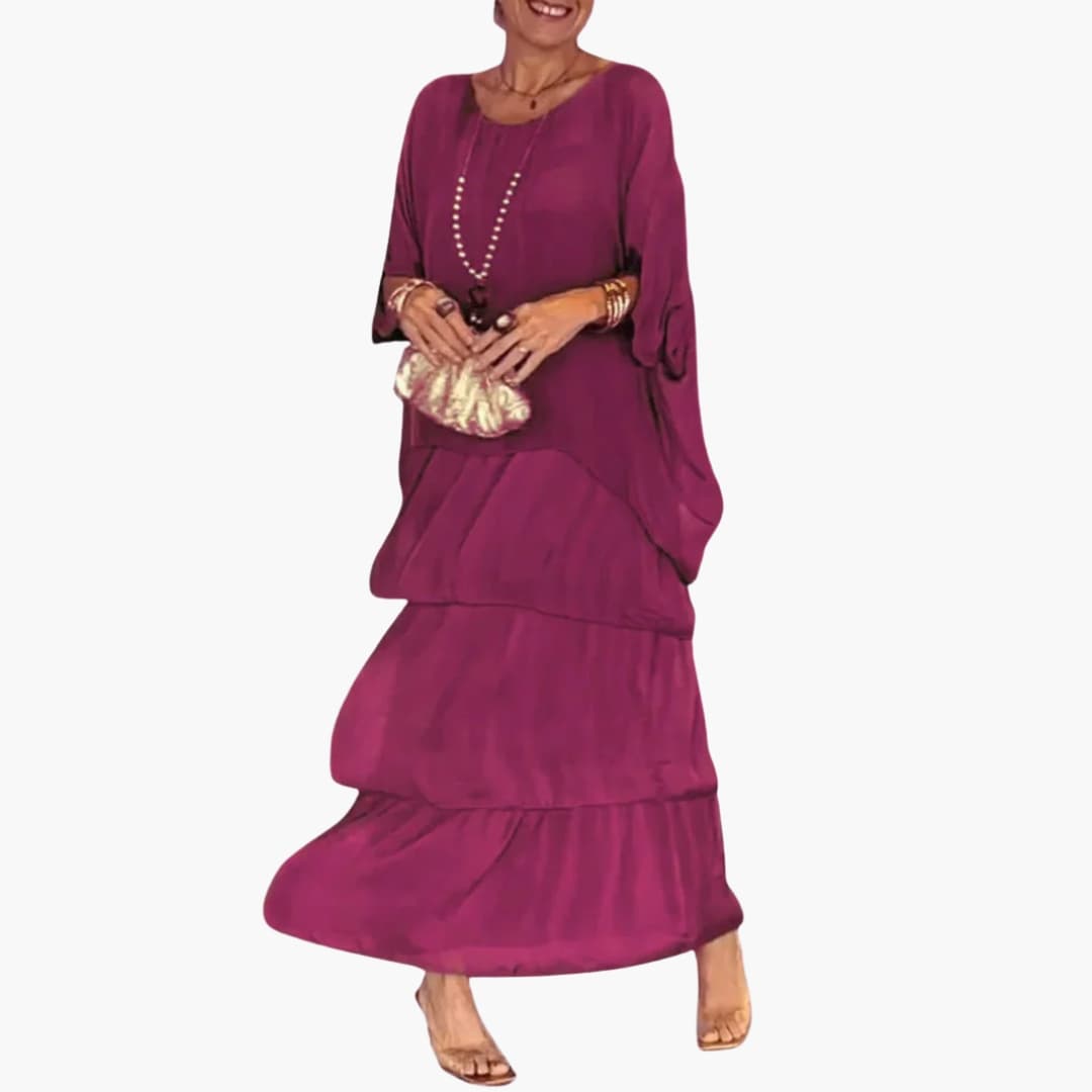 Stilfuld kvinders maxi kjole med elegant A-line snit, smock ærmer og rund hals. En alsidig lang kjole til sommer og hverdag.