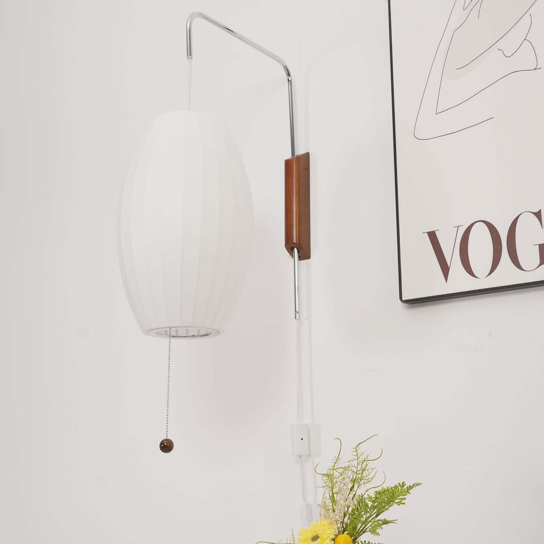 Moderne væglampe med kugledesign og varmt hvidt lys