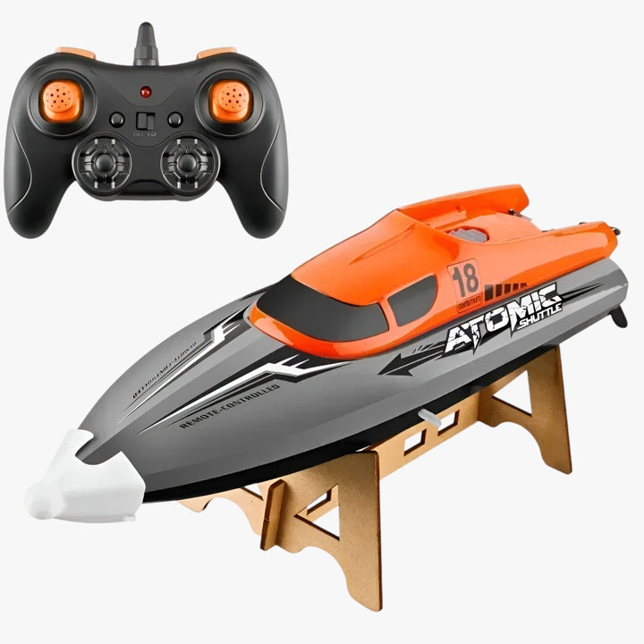 AquaX RC racerbåd, orange-grøn, med vandkøling og præcis fjernbetjening, ideel til vandløb, robust konstruktion.