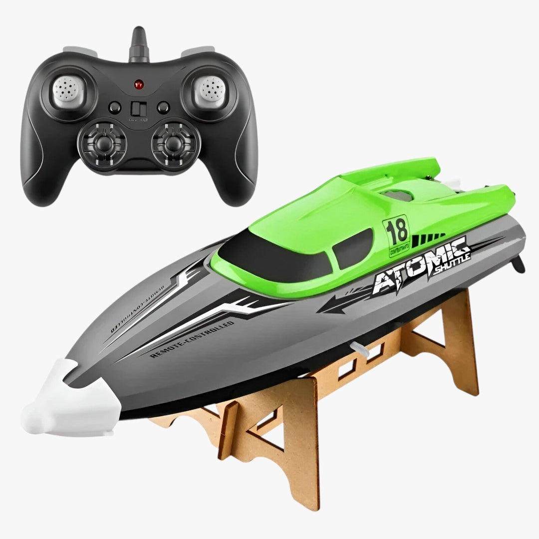 AquaX RC racerbåd, orange-grøn, med vandkøling og præcis fjernbetjening, ideel til vandløb, robust konstruktion.