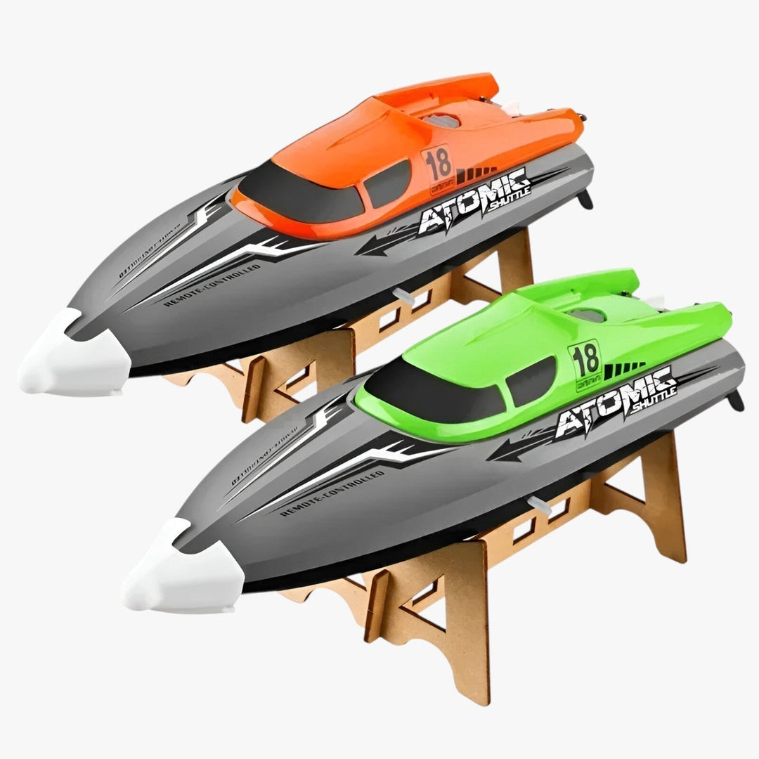 AquaX RC racerbåd, orange-grøn, med vandkøling og præcis fjernbetjening, ideel til vandløb, robust konstruktion.