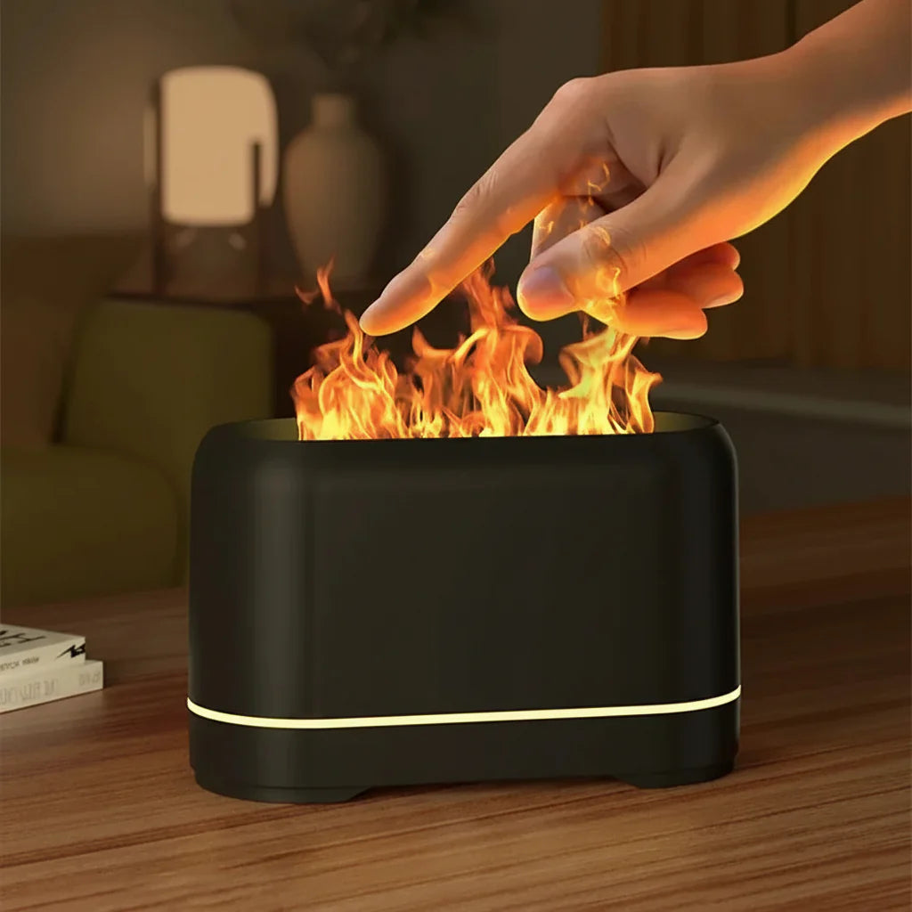 Stilfuld sort aromadiffuser med flammelys. Luftfugter og duftspreder, der skaber rolig atmosfære i hjemmet.
