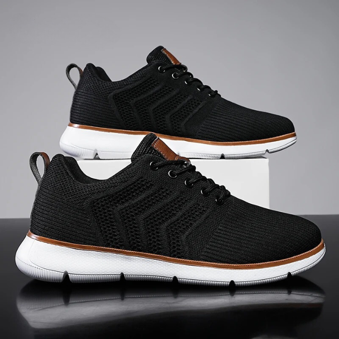 Detaljebillede af beige åndbar herrer sneaker, fremviser mesh-materiale og sålkonstruktion for komfort.