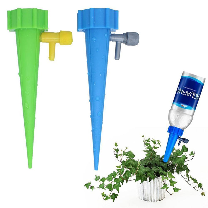 Automatisk selvvandingspind i grøn plastik, velegnet til plastikflasker, for problemfri havepleje og justerbar dryphastighed.