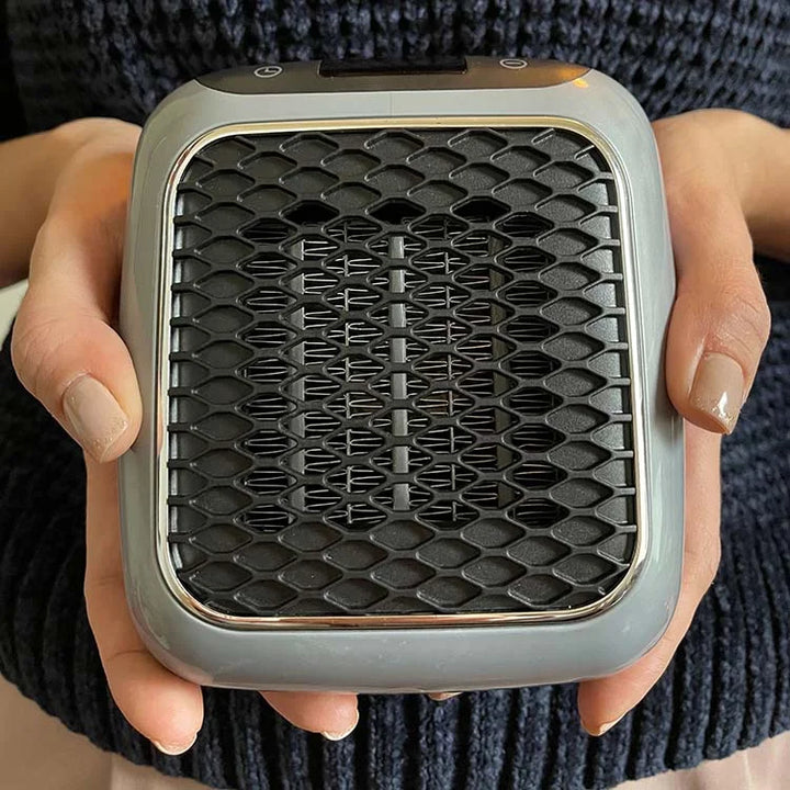 Skab hygge med effektiv varme. Kompakt varmeblæser, der er bærbar og energieffektiv for behagelig opvarmning.