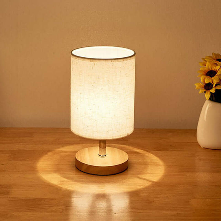 Minimalistisk bordlampe i træ og linned