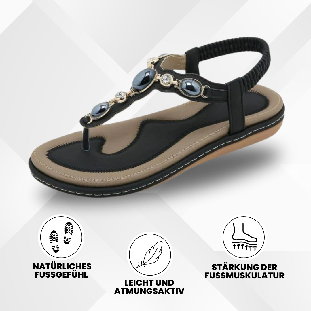 Komfortable, ergonomiske sandaler i abrikos med skridsikker sål, der fremmer fodsundhed på en lys baggrund.