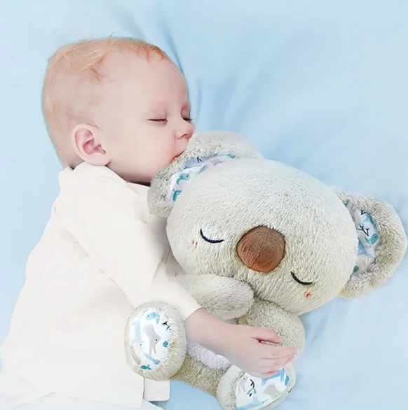 Beroligende koala-åndedrækslegetøj til børn, simulerer åndedrætsbevægelse, blide farver og integreret natlys.