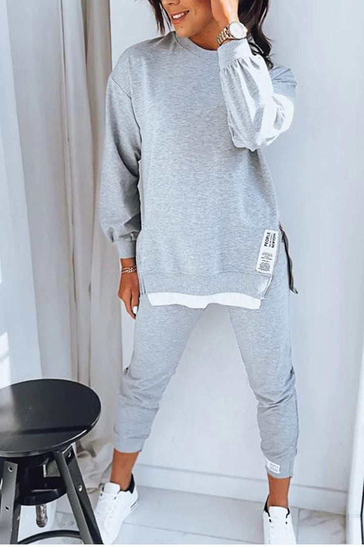 Blødt damesweatsæt med oversized trøje og matchende bukser, perfekt til afslappet loungewear.