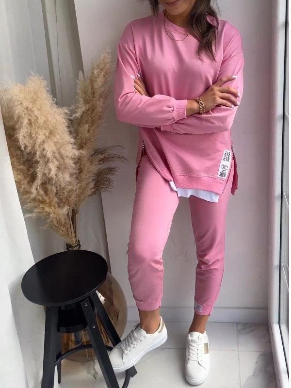 Dame sweatsæt med langærmet oversized sweatshirt og løse bukser i blødt stof, perfekt til afslappet mode.