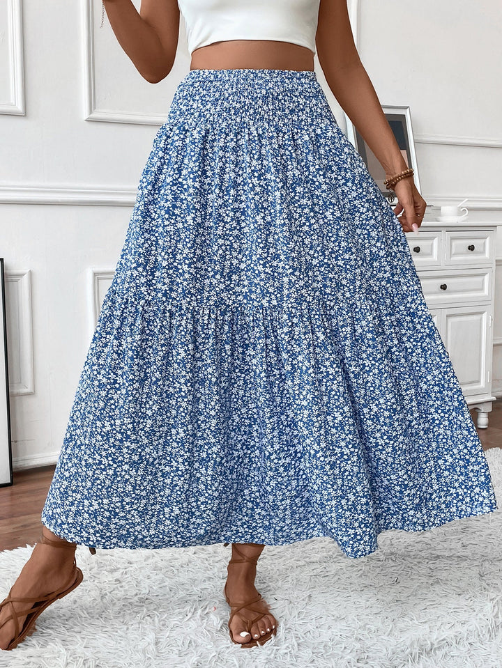 Afslappet lang blomstret nederdel med komfortabel elastisk talje og feminint volang print til kvinder.