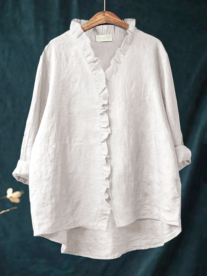 Feminin langærmet flæseskjorte til kvinder. Stilfuld bluse med fine rynkedetaljer til elegant hverdagslook.