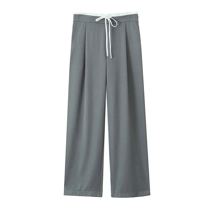 Brede ben damebukser med elastisk talje. Løs pasform for maksimal hverdagskomfort. Moderne polyester.