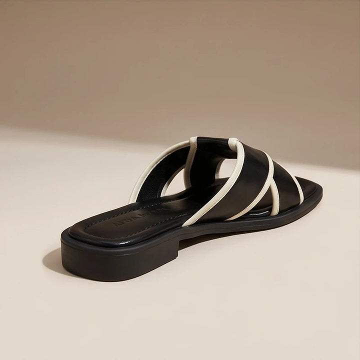Sorte dame fisherman sandaler med elegante krydsremme. Nemme slip-on sommer sandaler, flade og komfortable til hverdagsbrug.