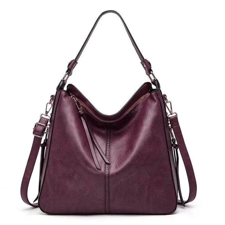 Alsidig Luna lædertaske som skuldertaske, crossbody eller håndtaske. Ideel til stilfuld damemode.