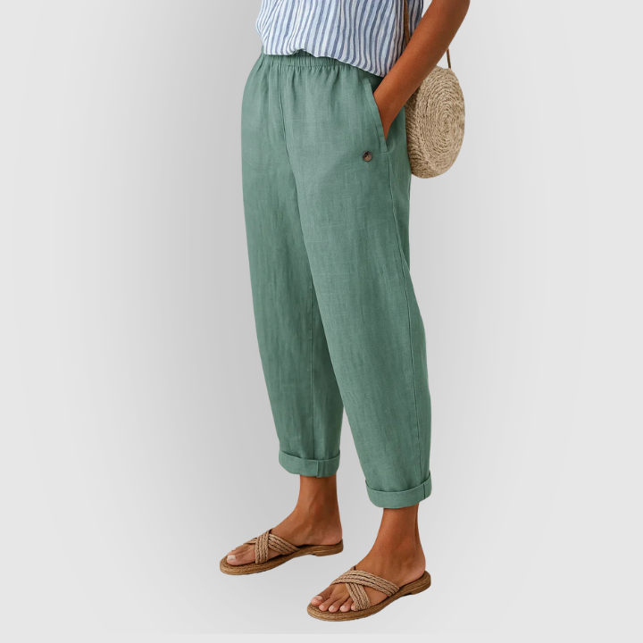 Model viser løse hørlook damebukser, lette og luftige, ideelle til afslappet sommerstil.