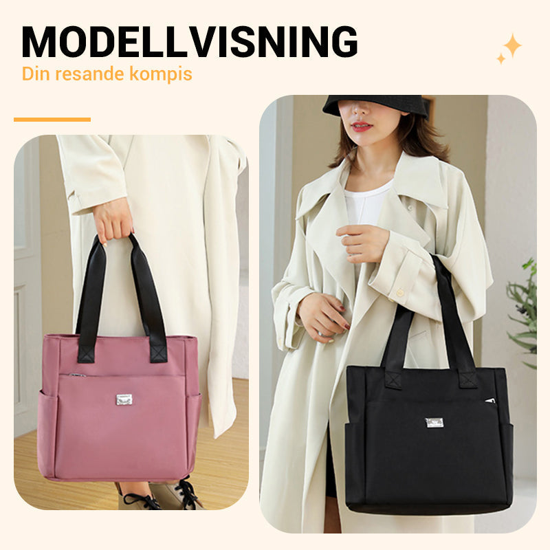 Stilfuld dame letvægts crossbody taske i vandtæt nylon. Ideel til organiseret hverdag.