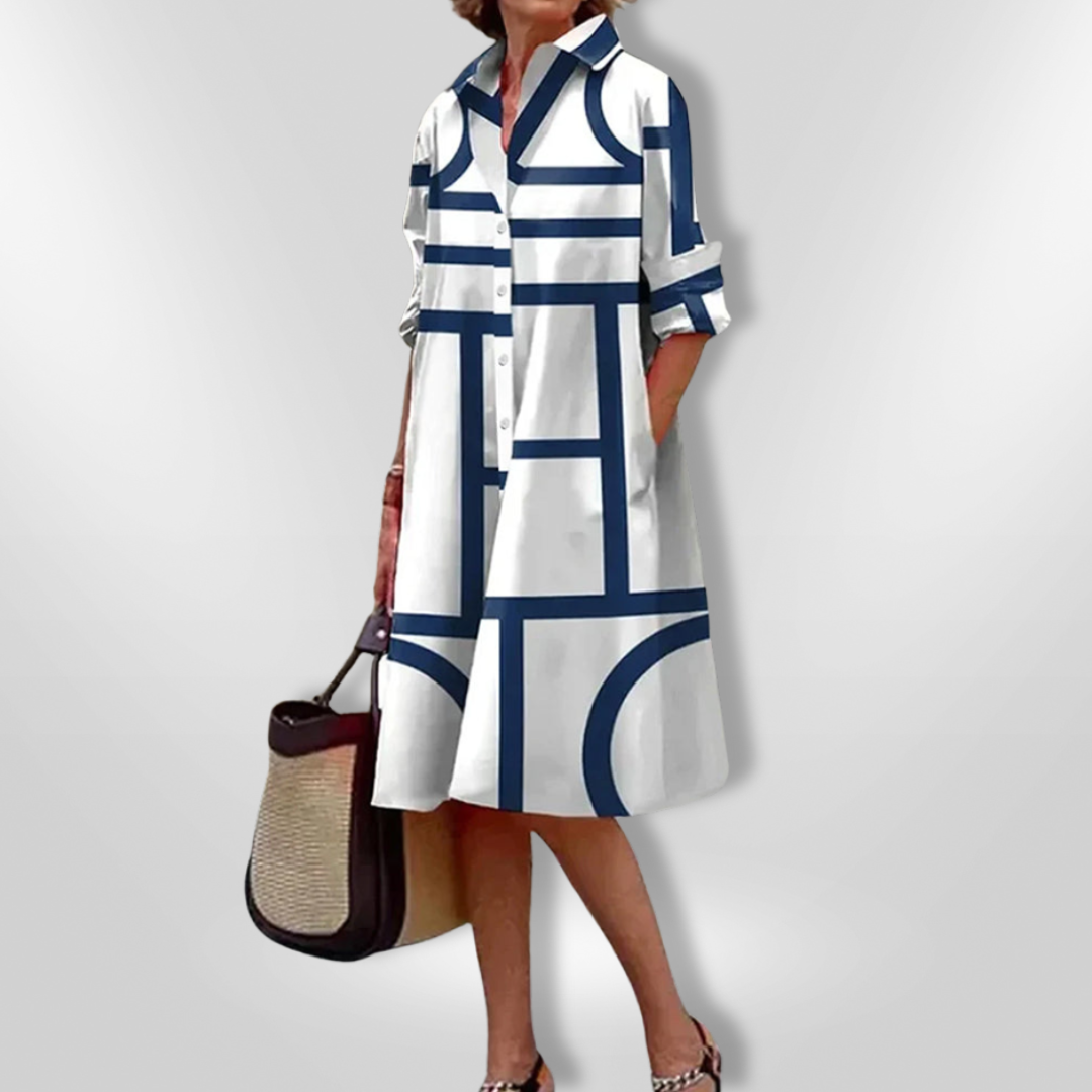 Sort elegant midi kjole med moderne geometrisk mønster. Komfortabel og stilfuld til enhver lejlighed.