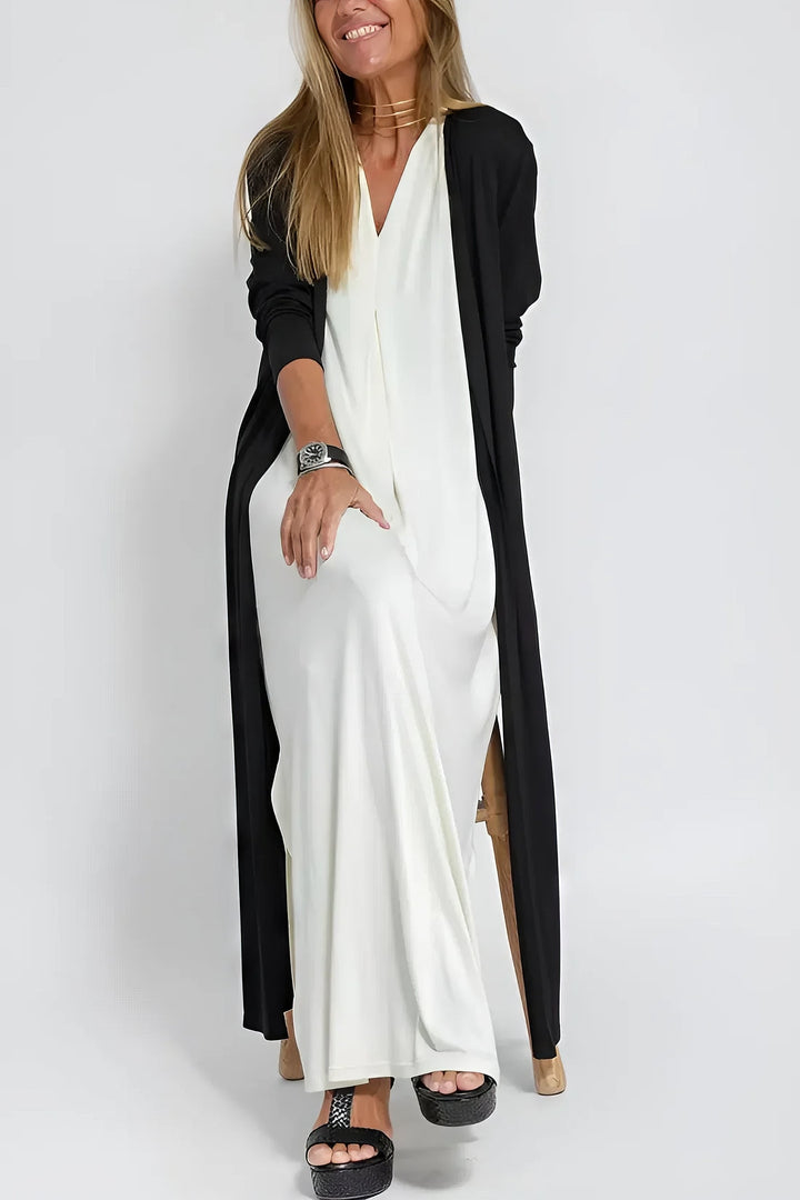 Smuk plus size festkjole til kvinder, lang model med ærmeløs design og elegant V-hals.